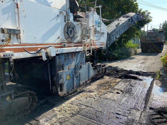 Milling the existing surface before resurfacing — Muhibah Konsortium Holdings civil works