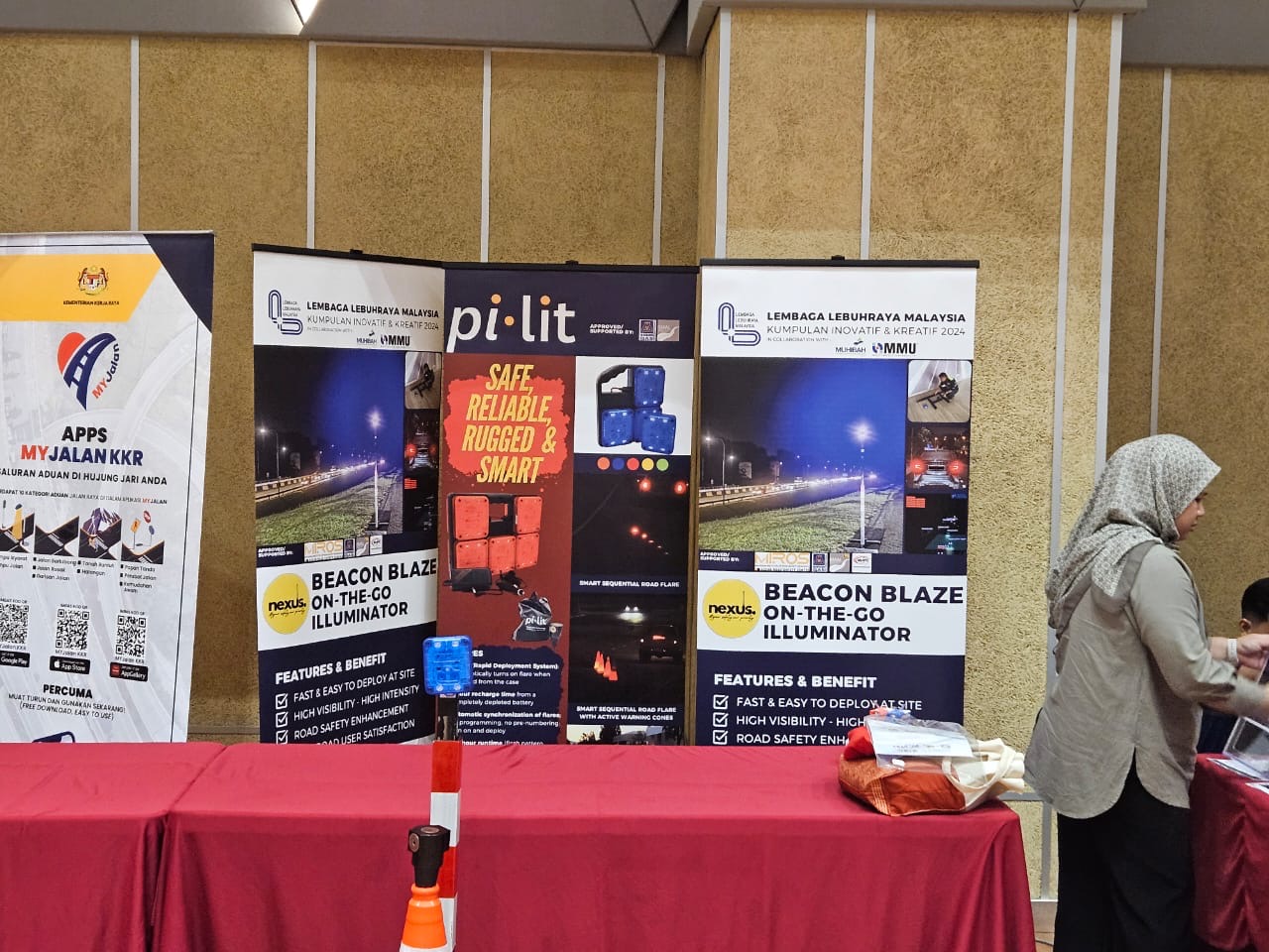 Muhibah Pi-Lit and Beacon Blaze exhibition booth showing MIROS-approved smart-flare technology and LLM collaboration banners